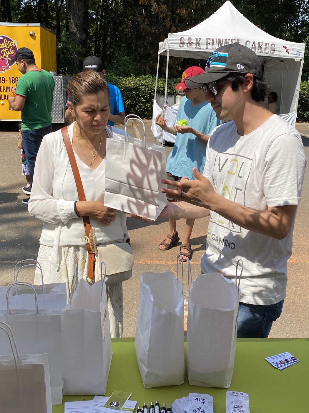CRI volunteer connecting with a community member at El Grito